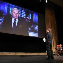 Tom Brokaw congratulates the Mormon Tabernacle Choir on the launch of its new YouTube channel in Salt Lake City, Tuesday, Oct. 30, 2012. Ryan Murphy, associate music director of the Mormon Tabernacle Choir, stands at front.