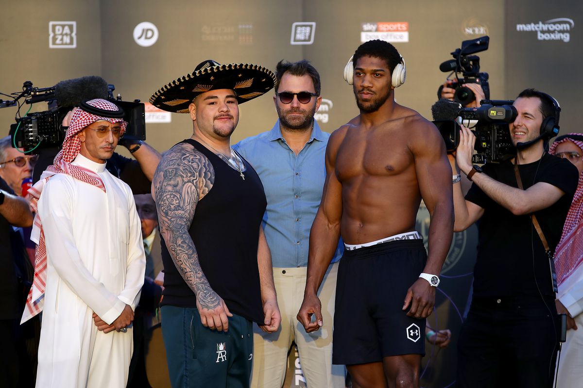 Andy Ruiz Jr and Anthony Joshua pose for photos after weighing in ahead of their IBF, WBA, WBO &amp; IBO World Heavyweight Title Fight during the Clash on the Dunes Weigh In at the the Al Faisaliah Hotel on December 06, 2019 in Riyadh, Saudi Arabia.