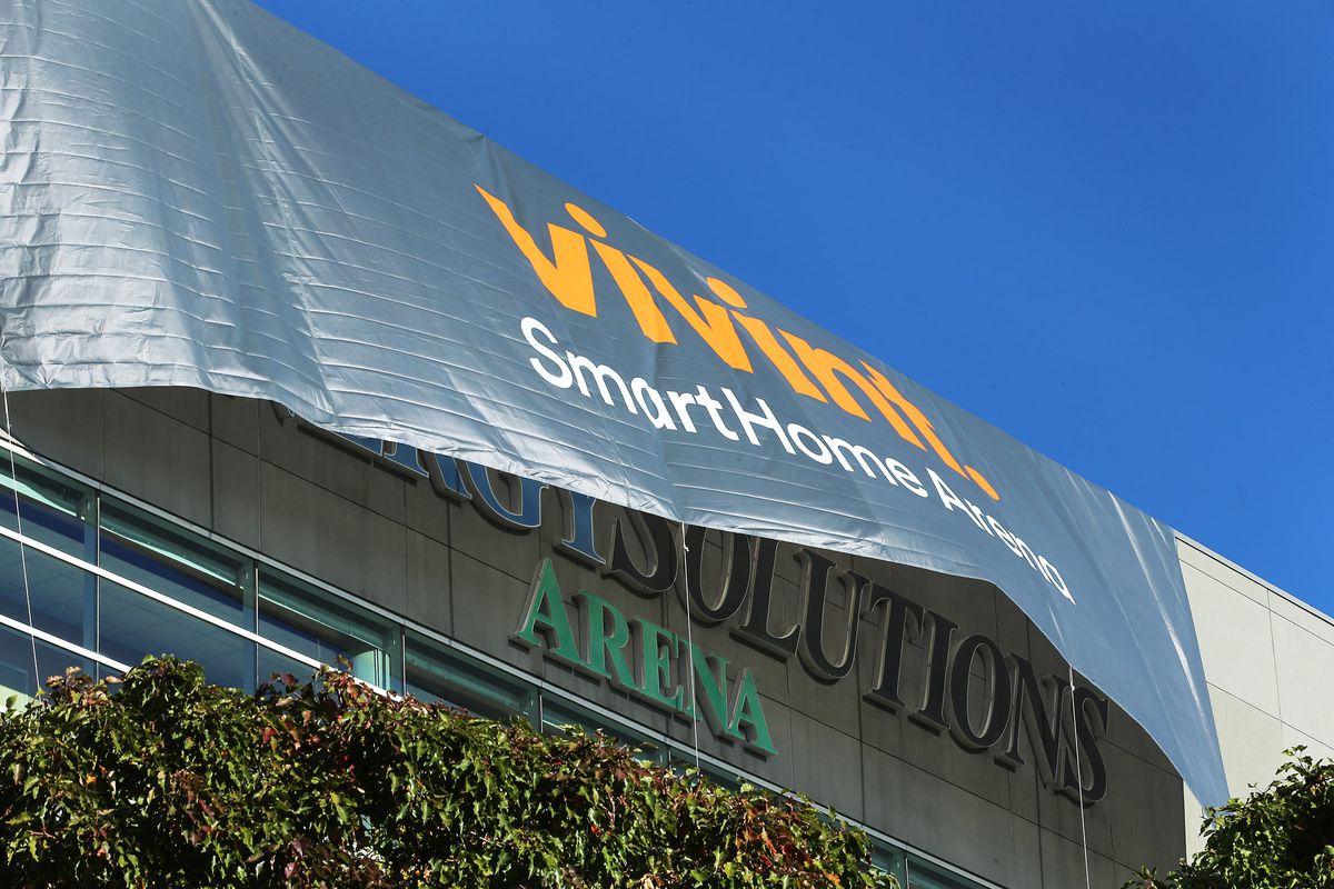 Crews put up banners showing the name change from EnergySolutions Arena to Vivint Smart Home Arena Monday, Oct. 26, 2015, in Salt Lake City.