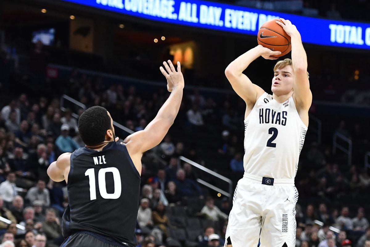 Georgetown Hoyas guard Mac McClung shoots over Butler Bulldogs forward Bryce Nze during the second half at Capital One Arena.