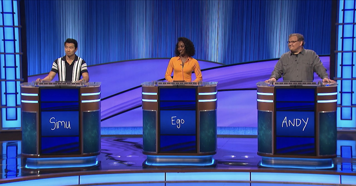 Simu Liu, Ego Nwodim, and Andy Richter standing at their respective Jeopardy! podiums