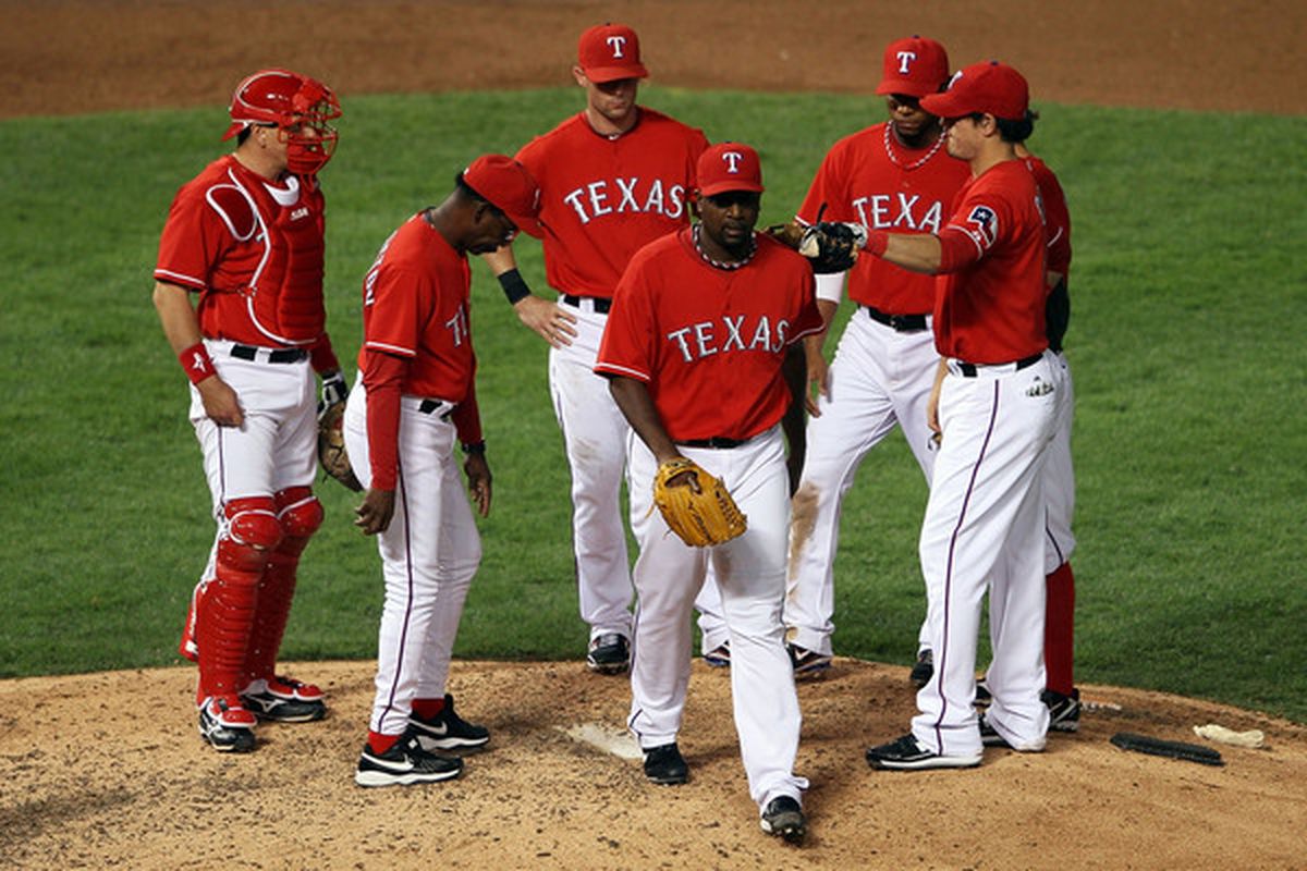 Darren Oliver of the Texas Rangers is pulled out of the game by manager Ron Washington in the eighth inning of Game One of the ALCS. A lot of this went on Friday night.  (Photo by Elsa/Getty Images)