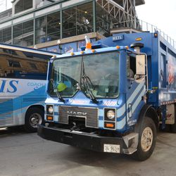 4:15 p.m. First garbage truck departs as visiting team bus backs in - 