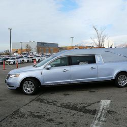 The hearse carrying the casket of  Utah Highway Patrol trooper Eric Ellsworth leaves the Dee Events Center in Ogden following funeral services on Wednesday, Nov. 30, 2016.