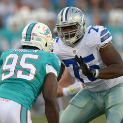 Aug 4, 2013; Canton, OH, USA; Dallas Cowboys defensive tackle Darrion Weems (75) defends against Miami Dolphins defensive end Dion Jordan (95) in the 2013 Hall of Fame Game at Fawcett Stadium.