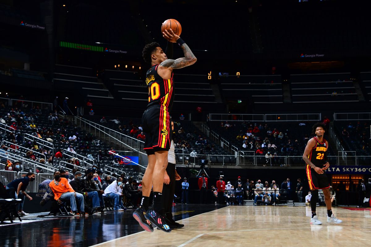 John Collins #20 of the Atlanta Hawks shoots a three point basket during the game against the Los Angeles Lakers on February 1, 2021 at State Farm Arena in Atlanta, Georgia.