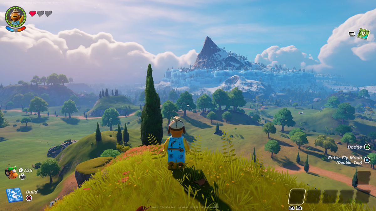 A Lego Fortnite character stands on a hill and looks at a valley in one of the best seeds in Lego Fortnite.