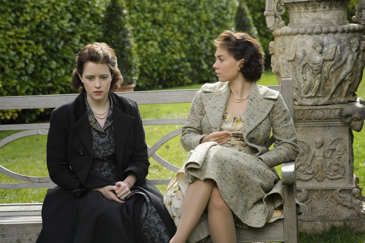 Princess Margaret and Queen Elizabeth chatting on a bench in "The Crown"