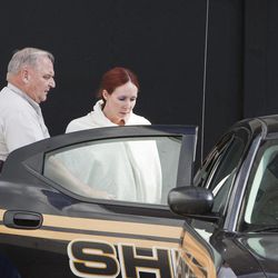 Shannon Richardson is placed into a Titus County Sheriff's car after an initial appearance Friday, June 7, 2013 at the federal building Texarkana, Texas. The FBI says Shannon Richardson admitted sending ricin-tainted letters to President Barack Obama and New York City Mayor Michael Bloomberg, but only after trying to pin it on her husband. 