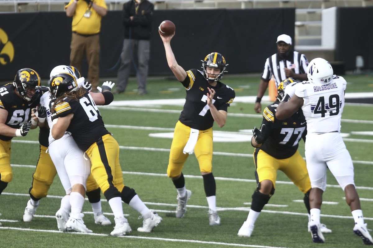 Quarterback Spencer Petras of the Iowa Hawkeyes throws a pass during the first half against the Northwestern Wildcats at Kinnick Stadium on October 31, 2020 in Iowa City, Iowa.