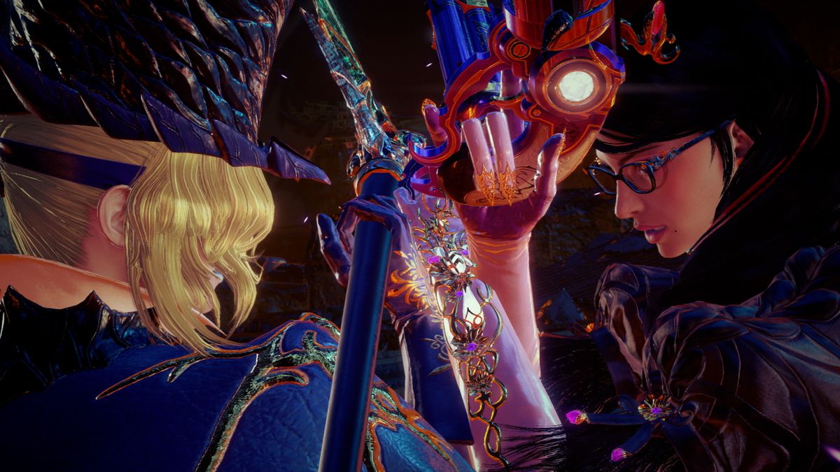 A French-speaking Bayonetta from another universe (left) clad in a blue top hat and jacket faces off against our universe’s Bayonetta (right) clad in black