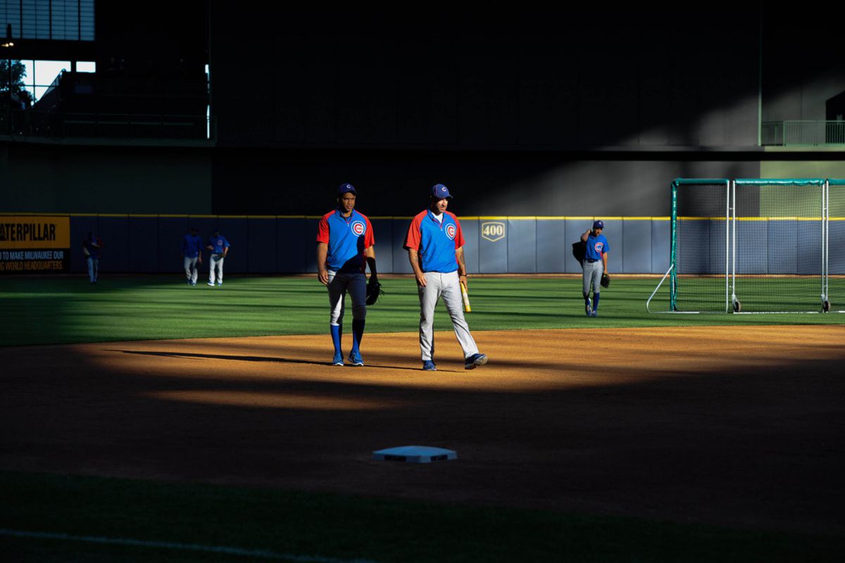 Milwaukee, WI, USA;  Chicago Cubs manager Dale Sveum and infielder Adrian Cardenas walk in after batting practice before a game against the Milwaukee Brewers at Miller Park. Credit: Benny Sieu-US PRESSWIRE