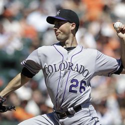 Colorado Rockies pitcher Jeff Francis (26) delivers against the San Francisco Giants during the first inning of a baseball game in San Francisco, Wednesday, April 10, 2013. 