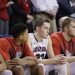 Players on the Gonzaga bench watch the closing minutes of the team's NCAA college basketball game against BYU, Saturday, Feb. 28, 2015, in Spokane, Wash. BYU won 73-70.
