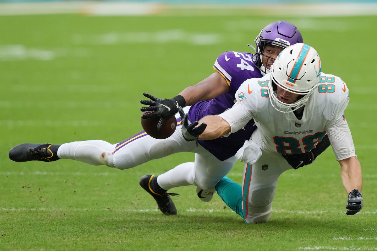 Camryn Bynum #24 of the Minnesota Vikings blocks a pass intended for Mike Gesicki #88 of the Miami Dolphins during the fourth quarterat Hard Rock Stadium on October 16, 2022 in Miami Gardens, Florida.