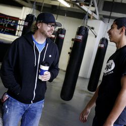 Mike McAuliffe became Isaac Lugo's foster parent after Lugo's father was deported to Mexico.  McAuliffe and Lugo hang out at  Foley's Mixed Martial Arts Training Center in Ogden on Saturday, November 12, 2011.  The two met at Foley's and became friends.
