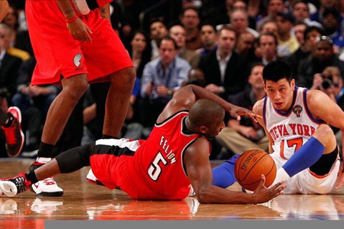 Mar. 14, 2012; New York, NY, USA; New York Knicks point guard Jeremy Lin (17) and Portland Trail Blazers point guard Raymond Felton (5) scramble for the ball during the first half at Madison Square Garden.  Mandatory Credit: Debby Wong-US PRESSWIRE