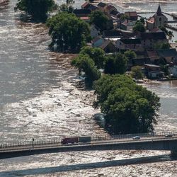 A view from  Radobyl  hill at a highway and the village Mlekojedy flooded by the swollen river Elbe near Litomerice, 70 kilometres (43 miles) northwest of Prague,  taken on Wednesday, June 5, 2013. Heavy rainfalls caused flooding in Germany, Austria, Switzerland and the Czech Republic. 