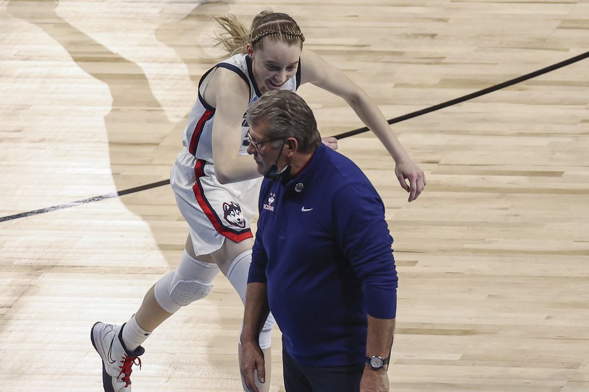 UConn Huskies guard Paige Bueckers (5) reacts with head coach Geno Auriemma during the fourth quarter against the Iowa Hawkeyes in the Sweet Sixteen of the 2021 Women’s NCAA Tournament at Alamodome.