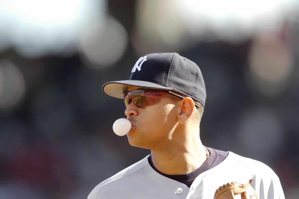 New York Yankees’ third baseman Alex Rodriguez blows a bubbl