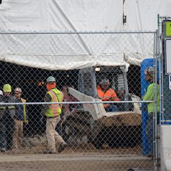 Dirt being brought out from the concourse, at the main gate -