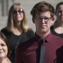 Matt Conway stands beside Gail Turpin during a press conference held by the LGBT rights protesters known as the “Capitol 13” in response to the charges that have been filed against them, Thursday, Aug. 28, 2014.