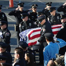 The body of West Valley police officer Cody Brotherson arrives prior to funeral services at the Maverik Center in West Valley City on Monday, Nov. 14, 2016.