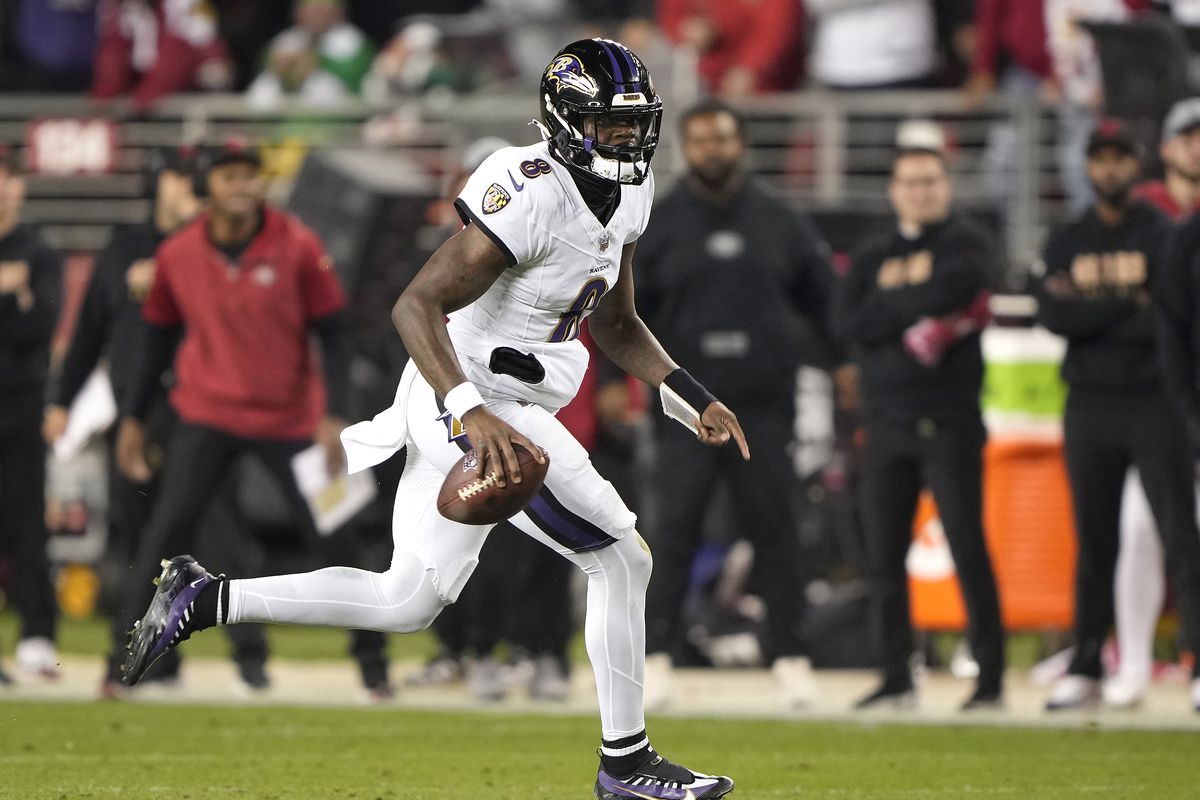 Lamar Jackson #8 of the Baltimore Ravens scrambles with the ball against the San Francisco 49ers during the second quarter of an NFL football game at Levi’s Stadium on December 25, 2023 in Santa Clara, California.