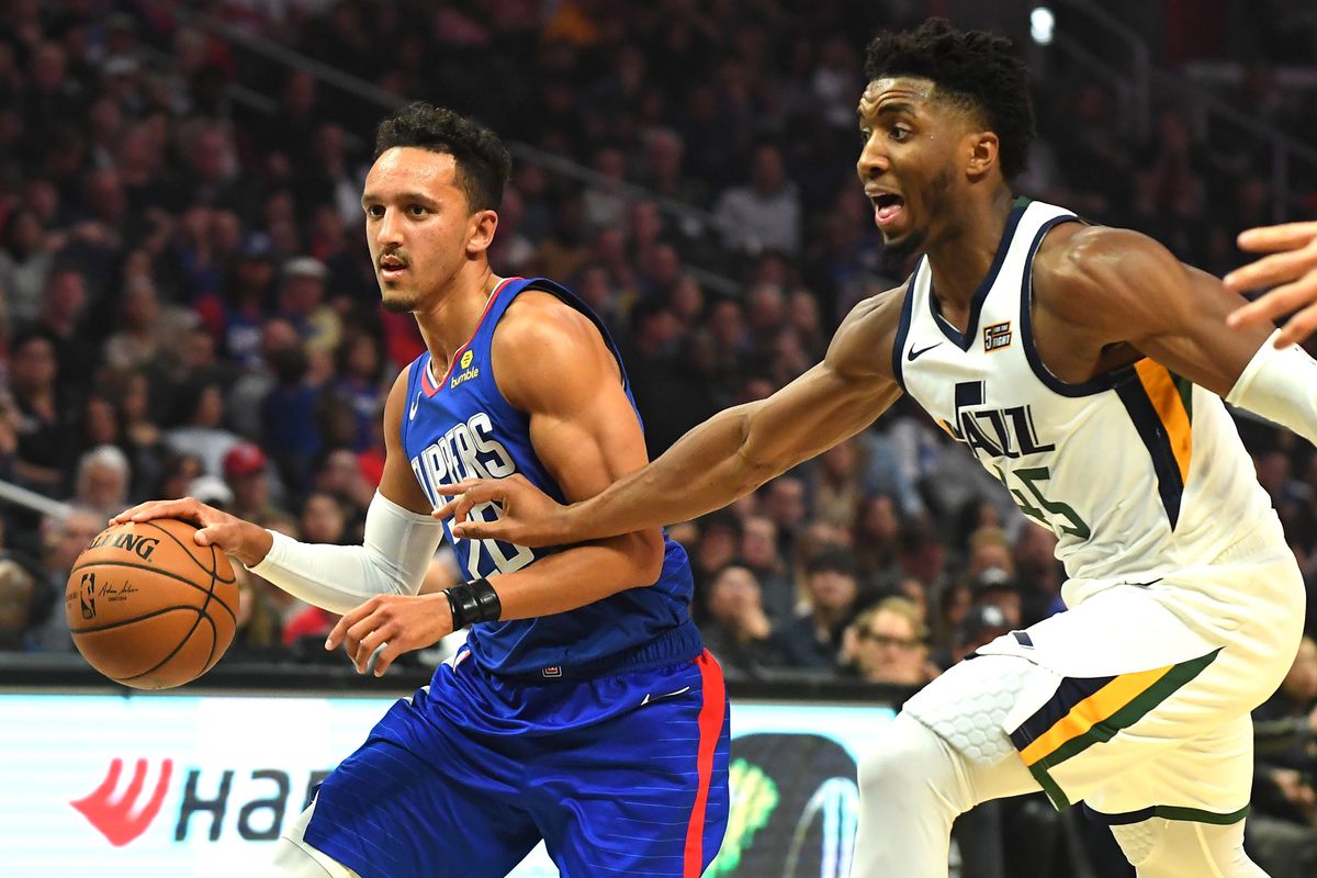 Utah Jazz guard Donovan Mitchell defends Los Angeles Clippers guard Landry Shamet in the second half of the game at Staples Center.