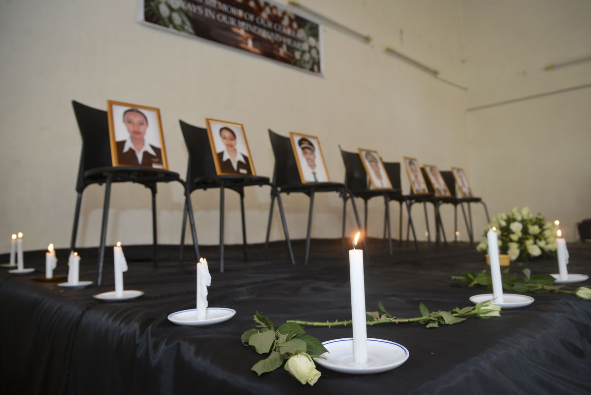 Framed photographs of seven crew members are displayed at a memorial service held by an association of Ethiopian airline pilots, in Addis Ababa, Ethiopia Monday, March 11, 2019. Authorities in Ethiopia, China and Indonesia grounded all Boeing 737 Max 8 ai