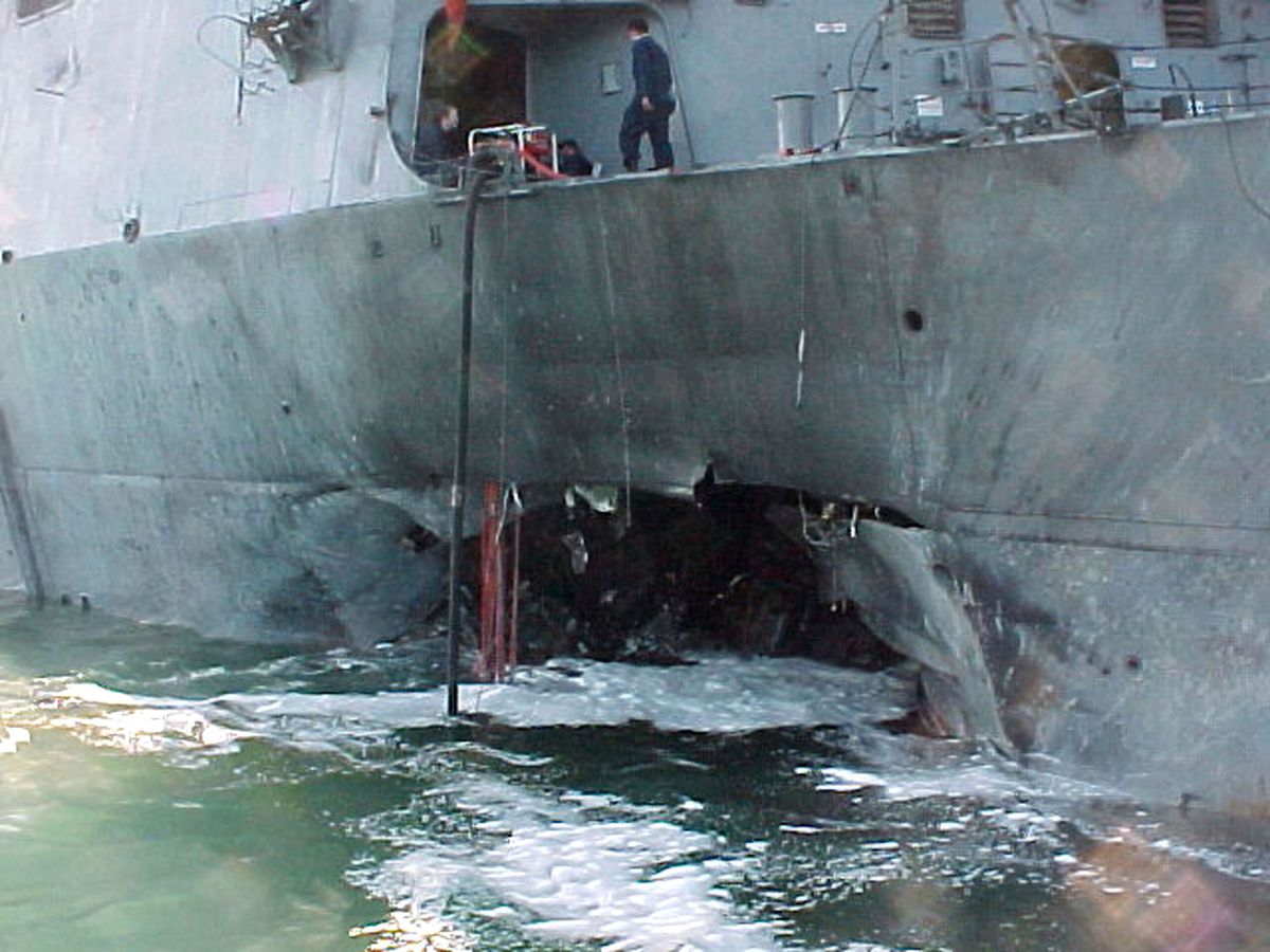 A gaping hole mars the port side of USS Cole after a terrorist bomb exploded and killed 17 US sailors and injured 39 others on October 12, 2000, in Aden, Yemen.