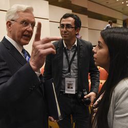 Elder D. Todd Christofferson member of Twelve Apostles of The Church of Jesus Christ of Latter-day Saints  talks to others members in a breack at the G20 Interfaith Forum in Buenos Aires, Argentina,  Sunday, Sep 26, 2018. (AP Photo/Gustavo Garello)

