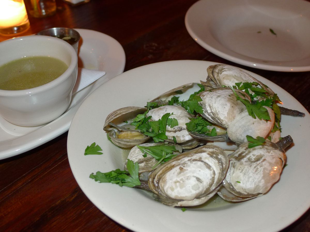 Steam clams and parsley and a bowl of broth on the side.