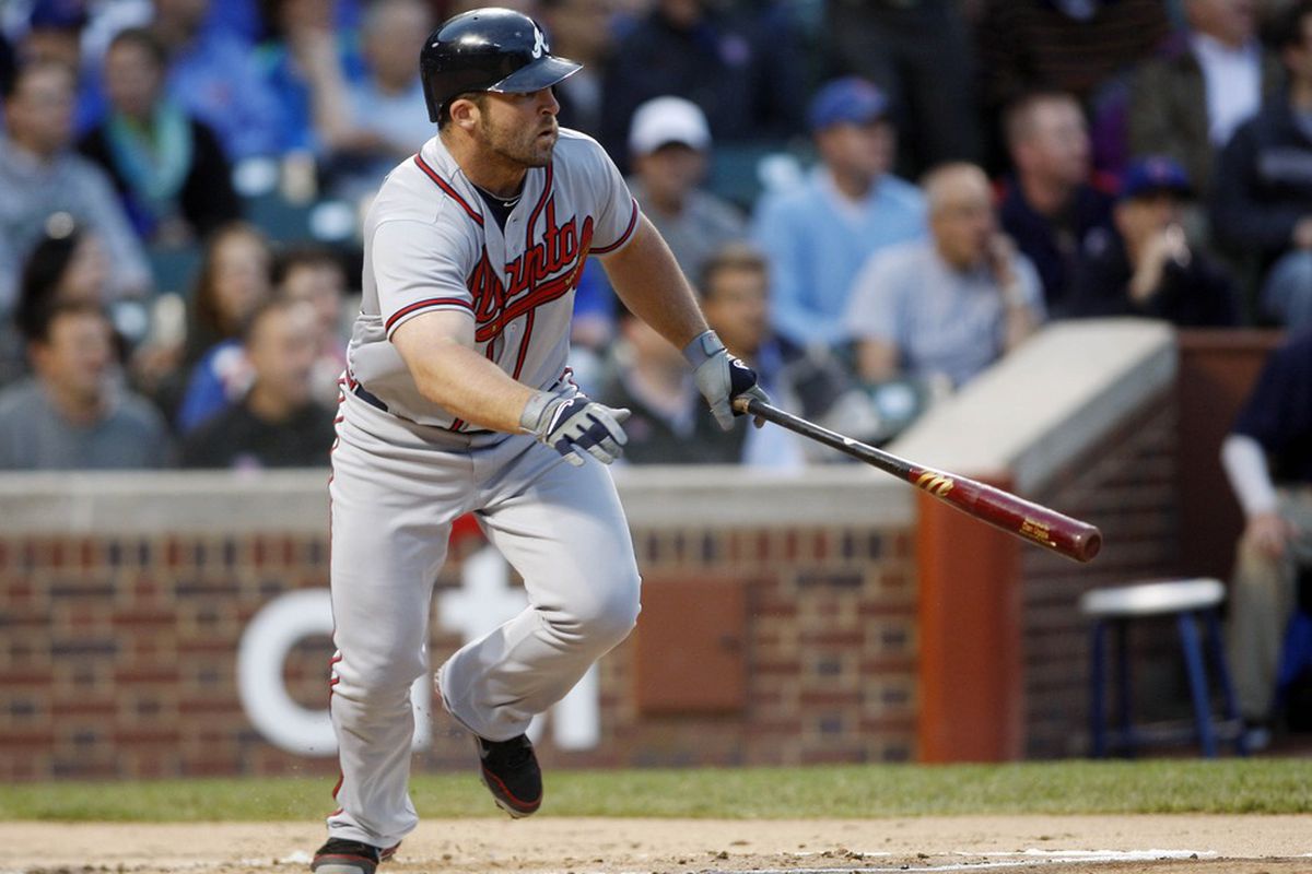May 8, 2012; Chicago, IL, USA; Atlanta Braves second baseman Dan Uggla hits a single during the second inning against the Chicago Cubs at Wrigley Field. Mandatory Credit: Jerry Lai-US PRESSWIRE