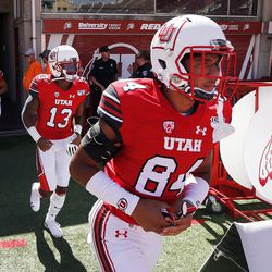 The Utah Utes take the field to warm up before facing the Idaho State Bengals in NCAA football in Salt Lake City on Saturday, Sept. 14, 2019.