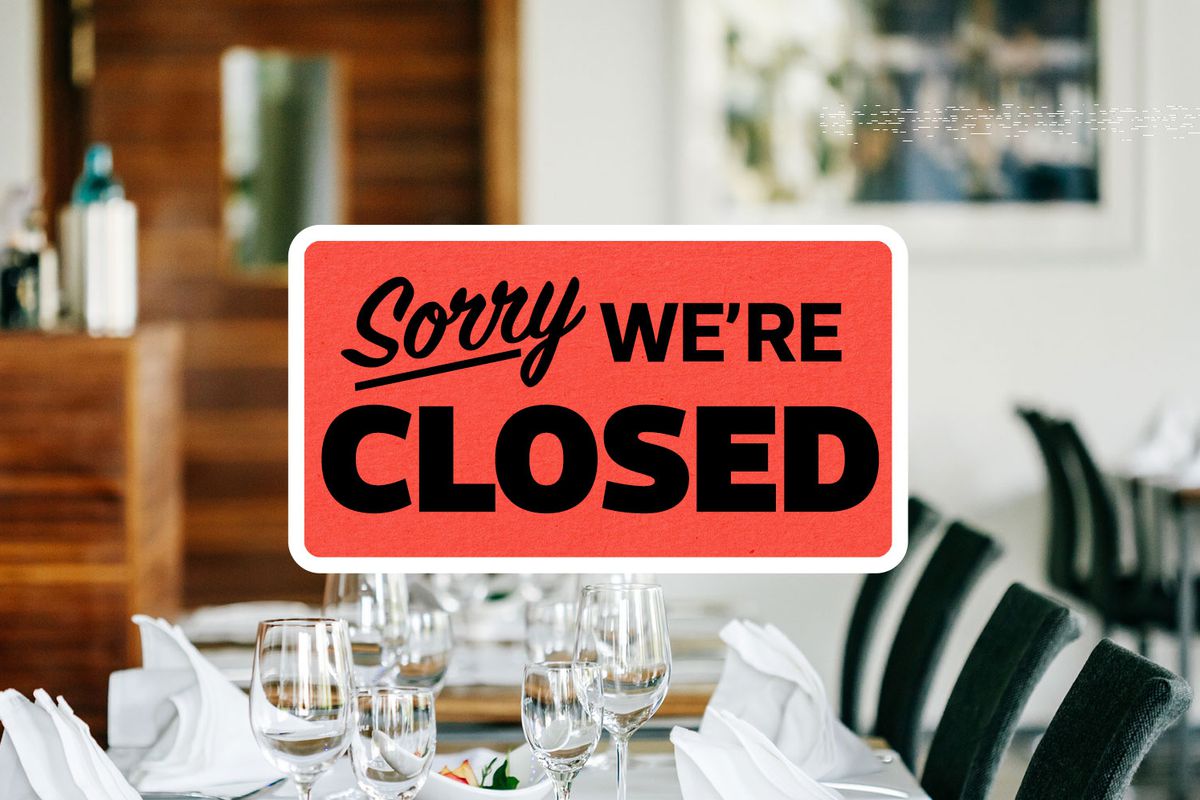 An orange rectangular sign with a white round border reading “Sorry, we’re closed” superimposed over a dining room photo.