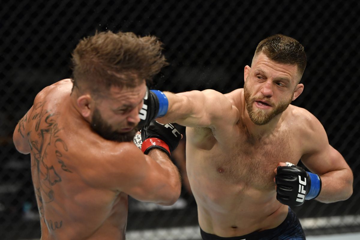 Calvin Kattar punches Jeremy Stephens in their featherweight fight during the UFC 249 event at VyStar Veterans Memorial Arena on May 09, 2020 in Jacksonville, Florida.
