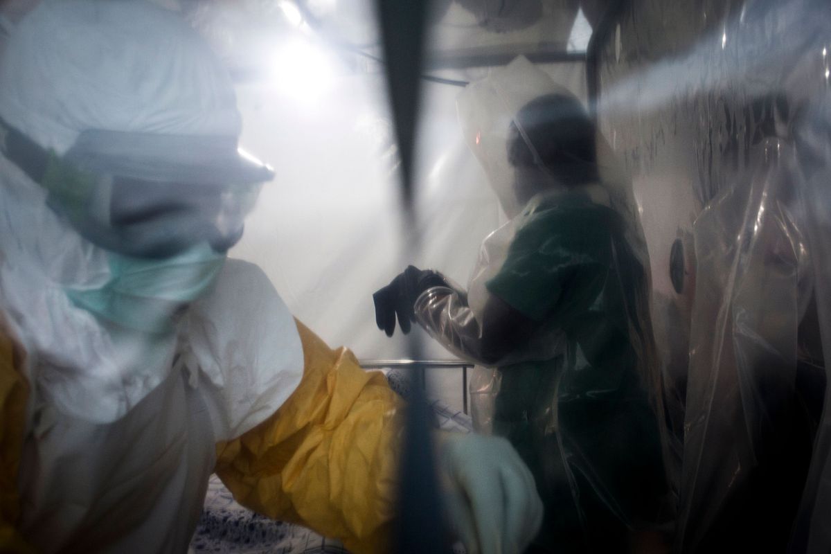 Two medical workers are seen in a Biosecure Emergency Care Unit on August 15, 2018 in Beni.