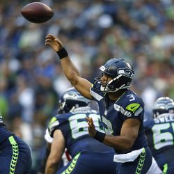 Seattle Seahawks quarterback Russell Wilson makes a pass against the San Francisco 49ers in the first half of an NFL football game, Sunday, Sept. 15, 2013, in Seattle.