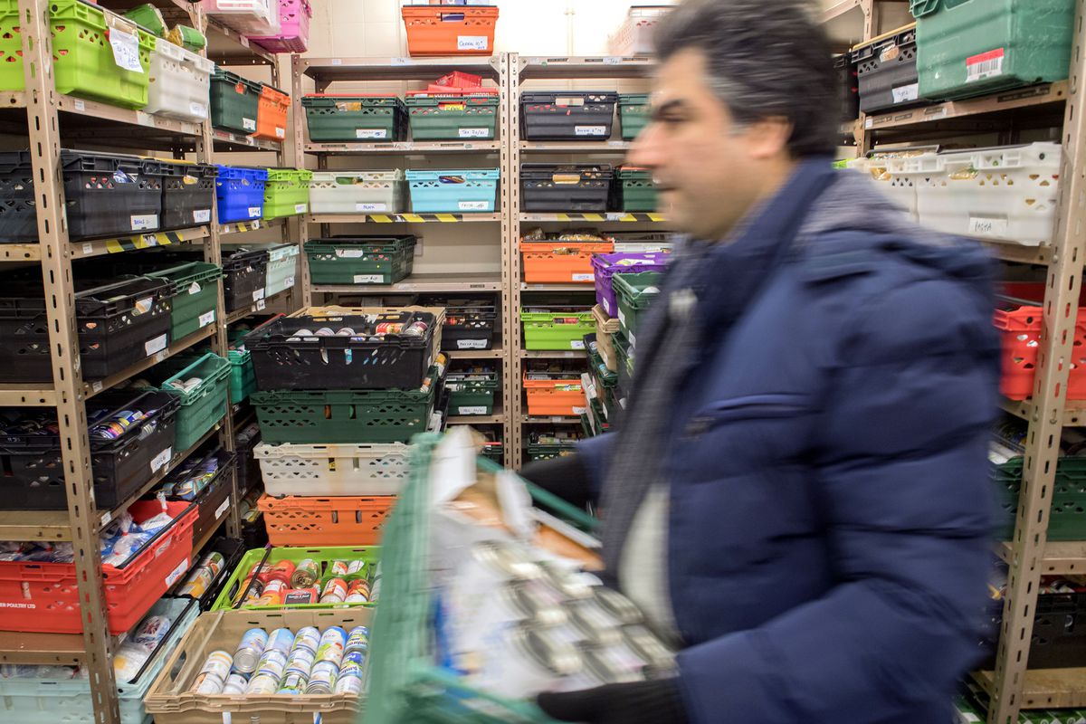 A U.K. food bank moves food donations for distribution