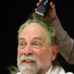 Science teacher Robert Hillier gets his head shaved during the Penny Wars Assembly at Sunset Junior High in Sunset on Wednesday, Dec. 21, 2016. Students raised $8,300 in five days doing a penny wars competition between seventh-, eighth- and ninth-graders to help families who can't afford Christmas. One of the incentives was getting to watch all the science teachers shave their heads if they raised enough money.