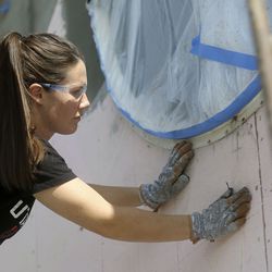 Kelsie Wadsworth preps a wall for stucco as she works on a house with McCoy’s Stucco Repair in Springville on Tuesday, Oct. 6, 2020. Wadsworth was connected to McCoy’s Stucco Repair through the Bacon app.