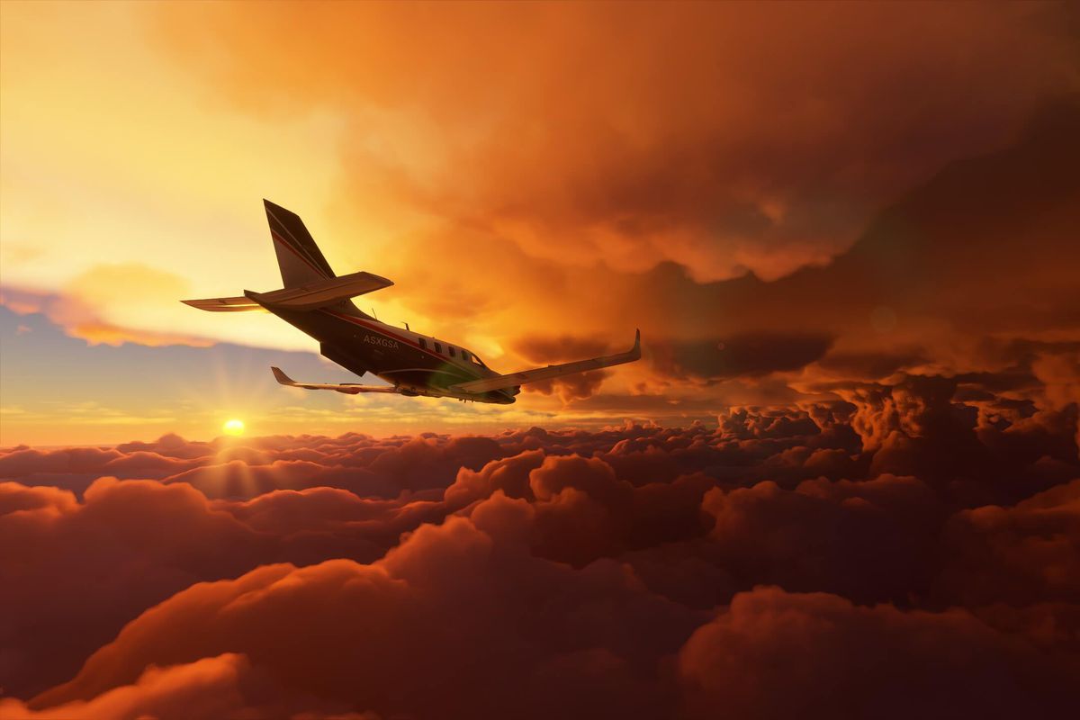 A turboprop plane flys through multiple cloud layers at sunset.