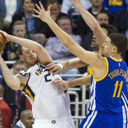 Utah forward Joe Ingles (2) looks to pass around Golden State guard Klay Thompson (11) during the second half of an NBA basketball game in Salt Lake City on Thursday, Dec. 8, 2016. Golden State defeated Utah with a final score of 106-99.