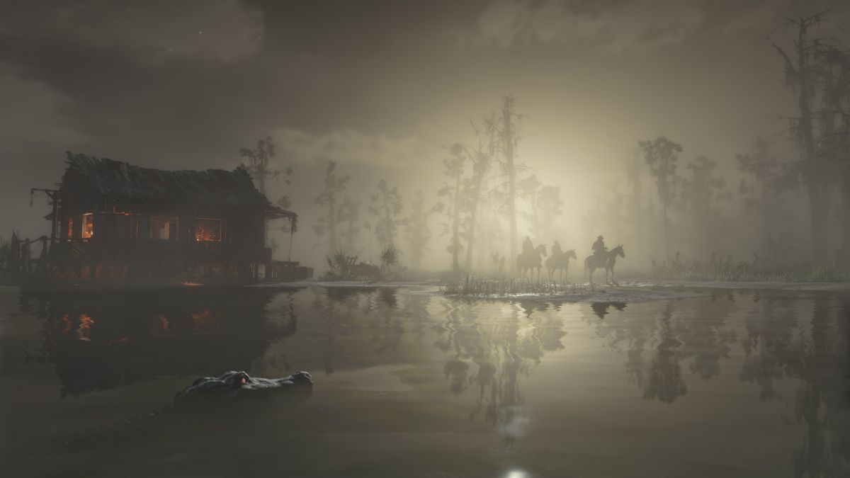 an alligator lurks just above the water at night as three figures on horseback stand by the water’s edge near a house in the fog in Red Dead Redemption 2