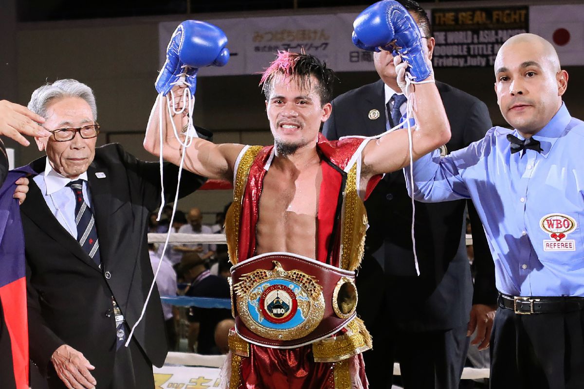 Vic Saludar of the Philippines (C) celebrates his win over Japan’s Ryuya Yamanaka after their WBO minimumweight title boxing bout in Kobe, Hyogo prefecture on July 13, 2018.