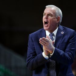 Brigham Young Cougars head coach Dave Rose cheers for his team as the BYU Cougars and San Diego Toreros play in WCC tournament action at the Orleans Arena in Las Vegas on Saturday, March 9, 2019. San Diego won 80-57.