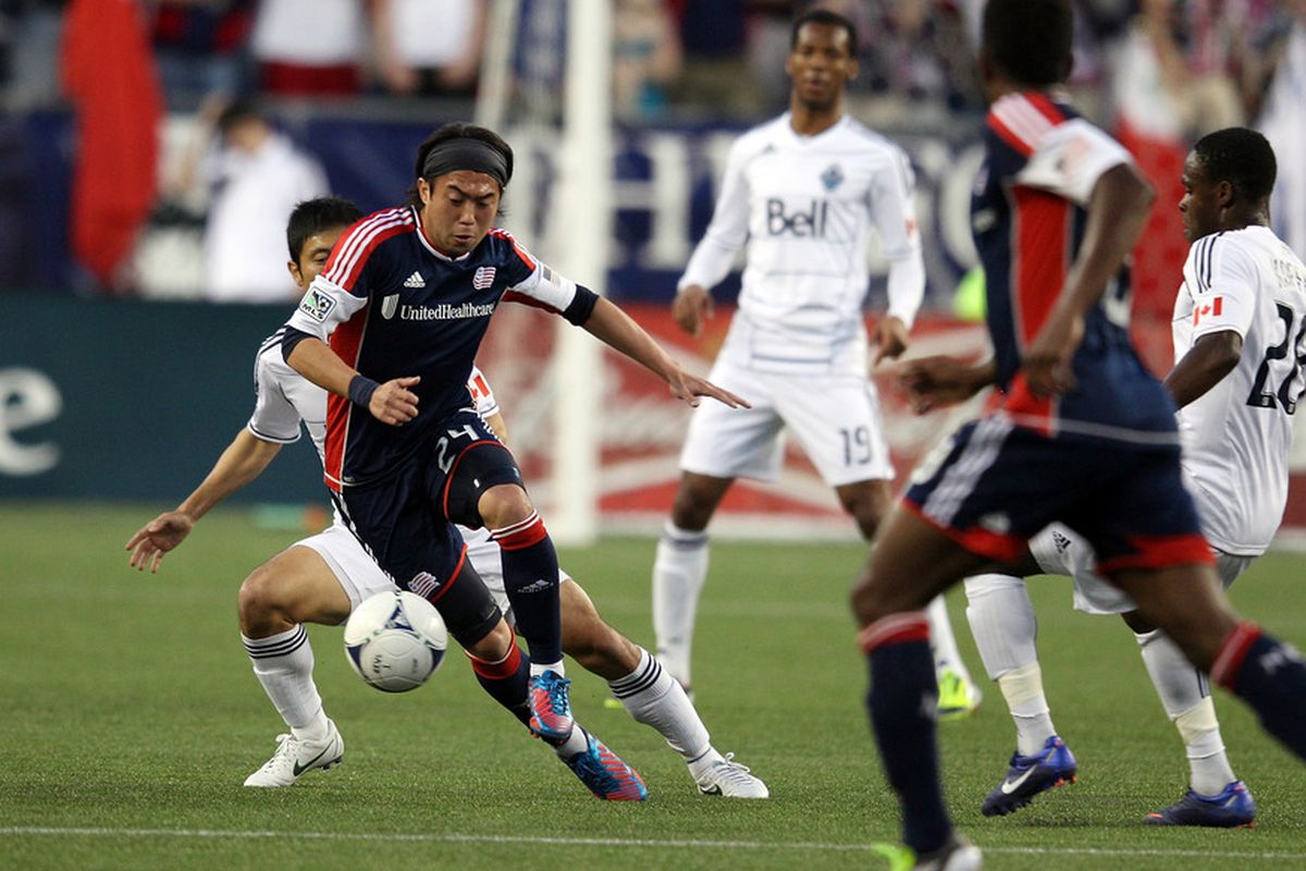 FOXBORO, MA - MAY 12:  Lee Nguyen #24 the New England Revolution keeps the ball from the Vancouver Whitecaps after scoring a goal in the first half at Gillette Stadium May 12, 2012 in Foxboro, Massachusetts. (Photo by Gail Oskin/Getty Images)