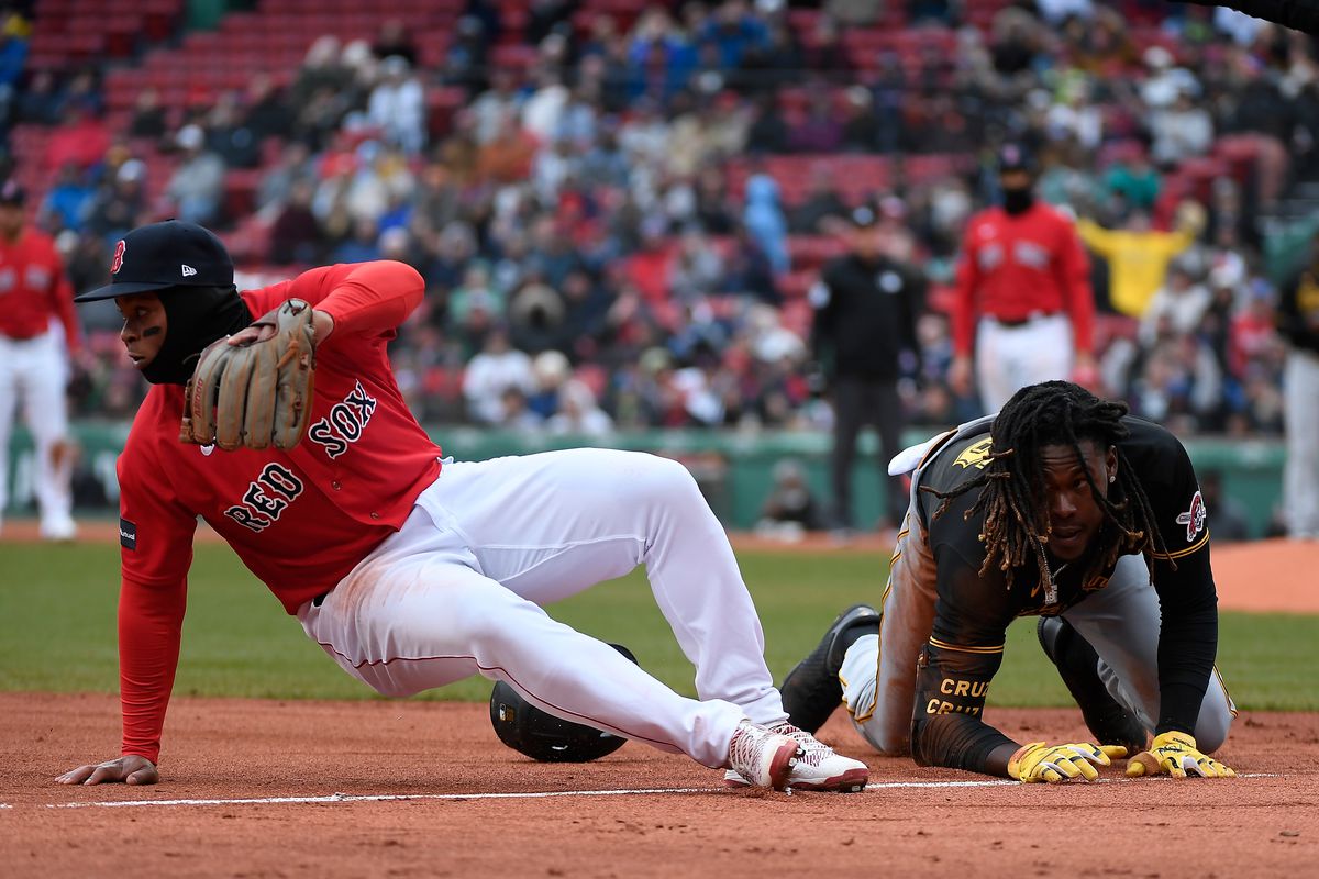 Pittsburgh Pirates shortstop Oneil Cruz and Boston Red Sox third baseman Rafael Devers collide at third base during the seventh inning at Fenway Park.