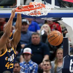 Utah Jazz guard Donovan Mitchell (45) dunks during the game against the Cleveland Cavaliers at Vivint Arena in Salt Lake City on Saturday, Dec. 30, 2017.